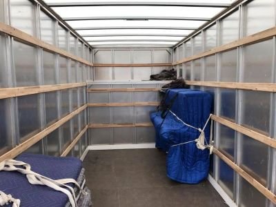 Upright piano in a removal van