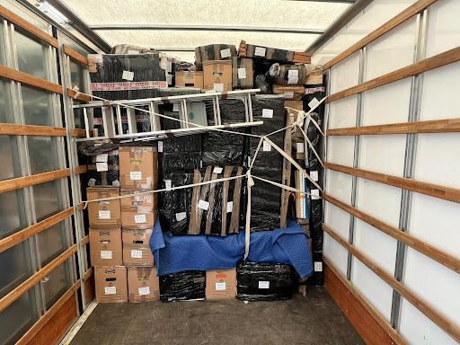 household items with labels stacked in the lorry