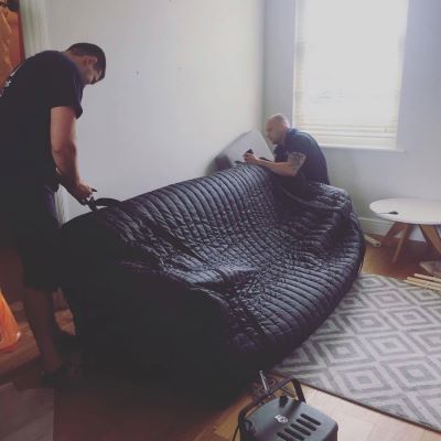 Covering a sofa before the move